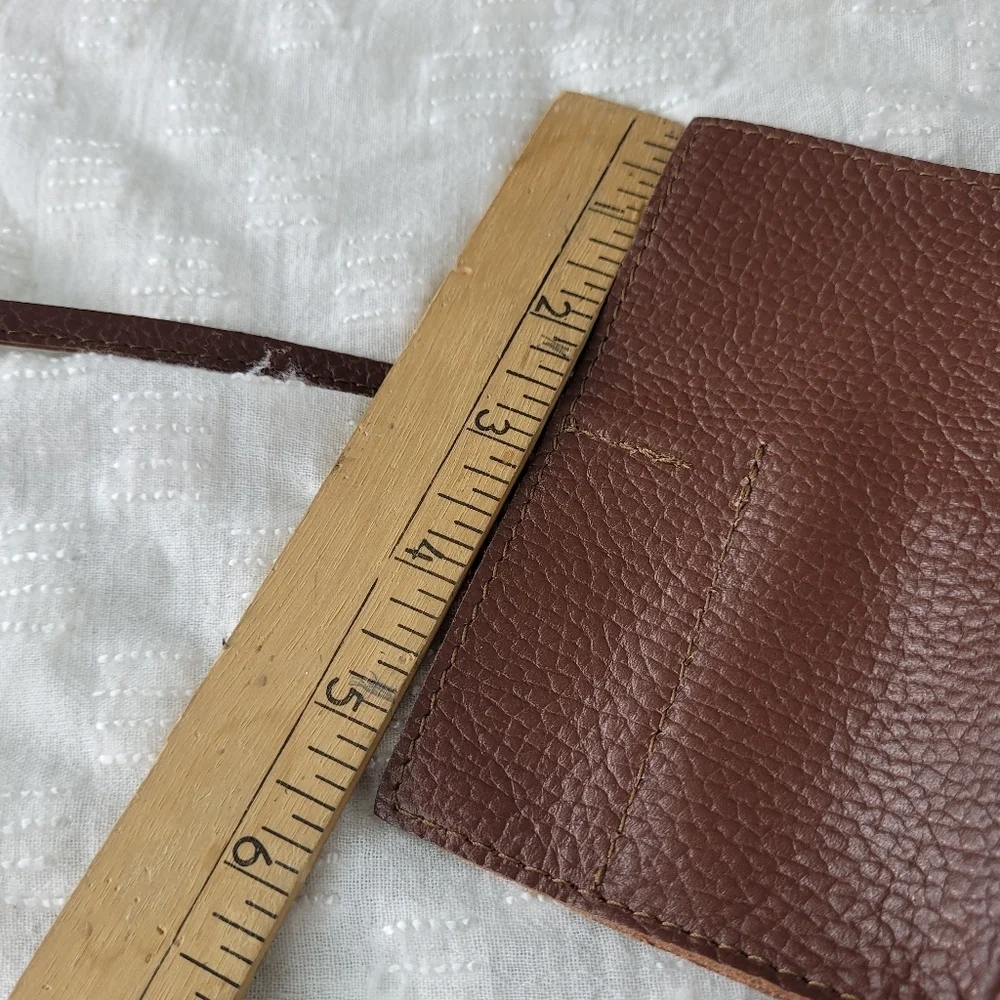 Mark & Graham brown pebbled leather charger rollup pockets tie closure minimal